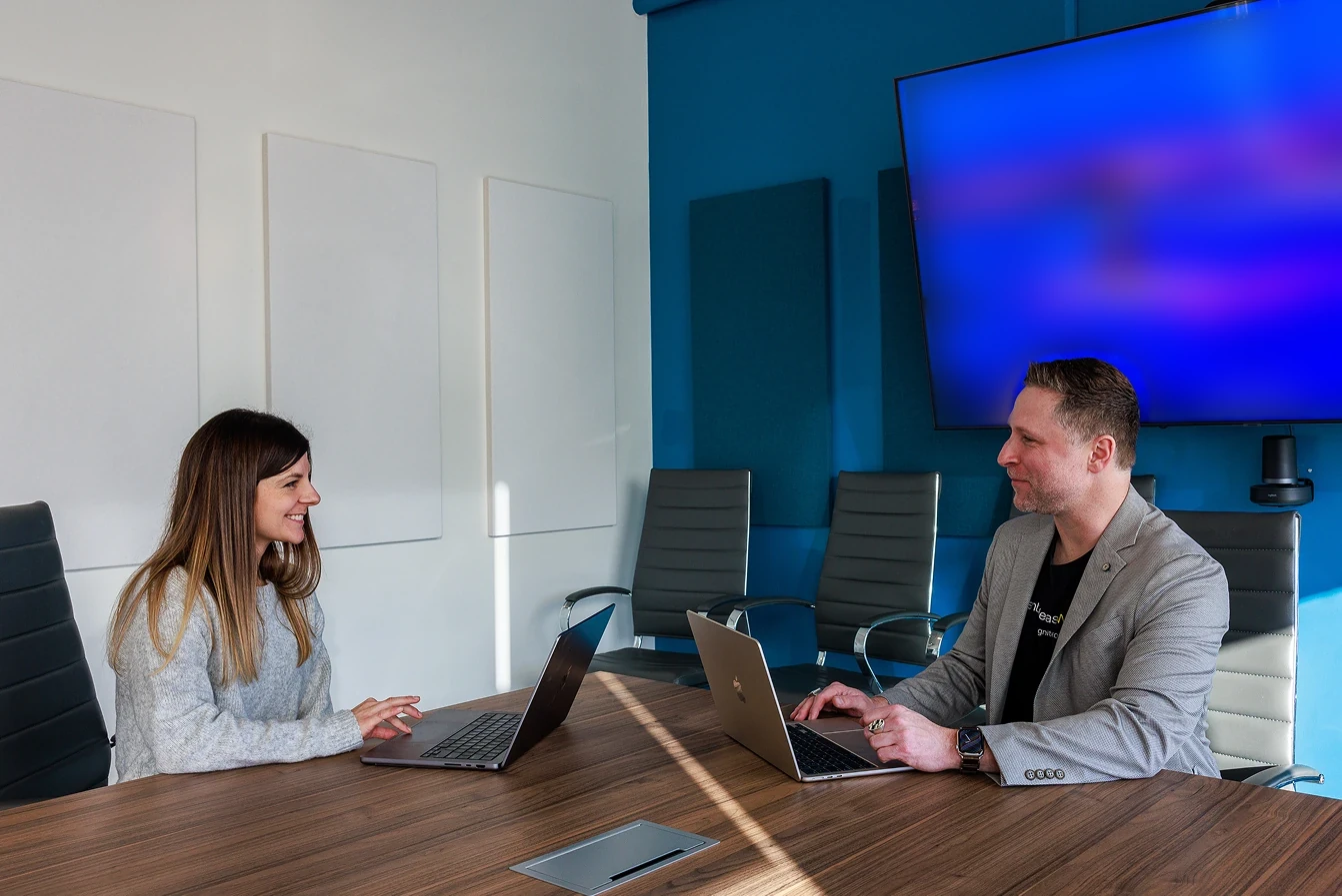 A working conversation with laptops